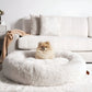 Calming Donut Dog Bed: sizing reference next to a dog