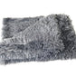 Calming Throw: bed in a living room setting