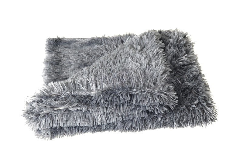 Calming Throw: bed in a living room setting